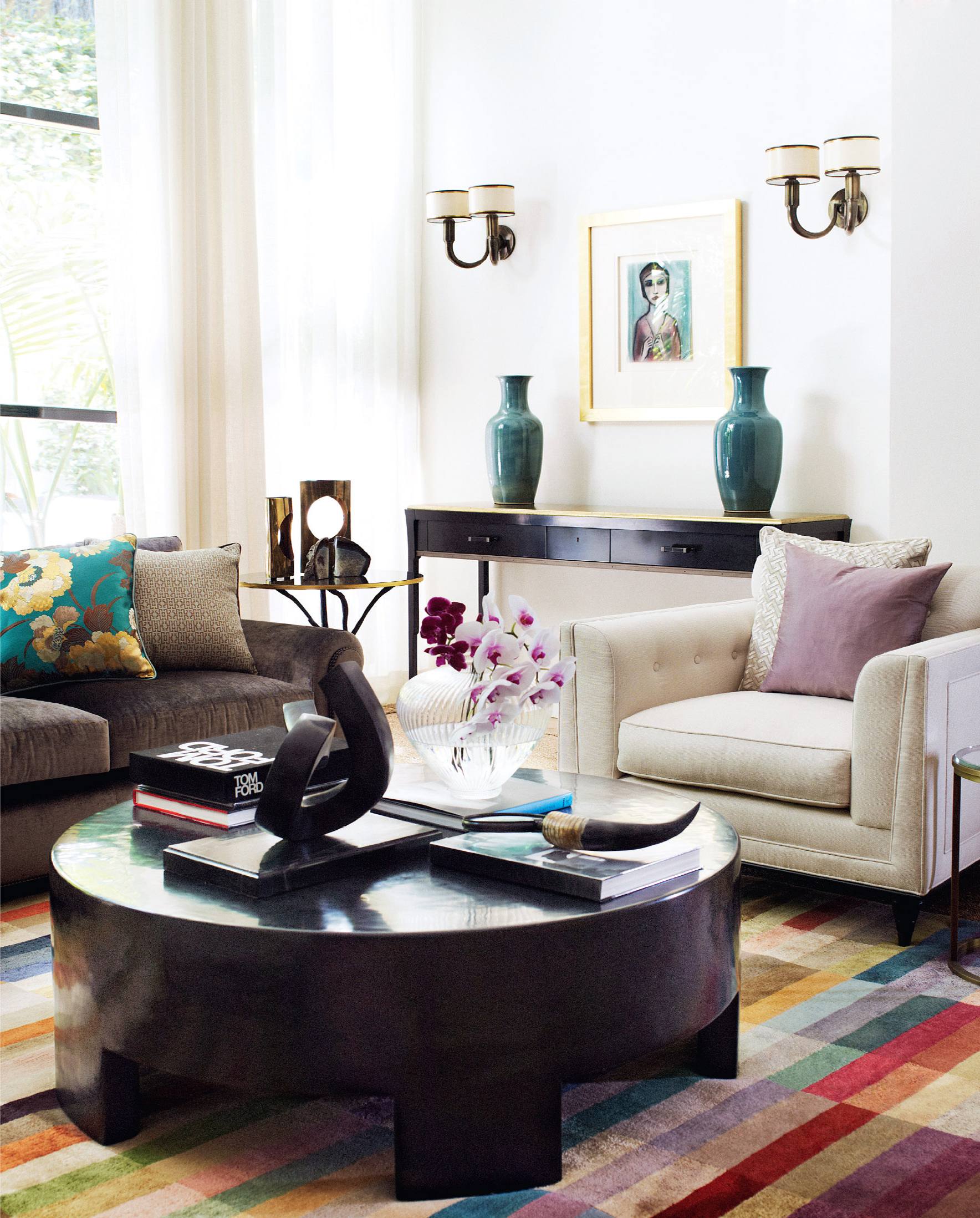 Living room with Baker console table, pastel artwork by Robert Dickerson and colourful rug, by Sydney interior designers