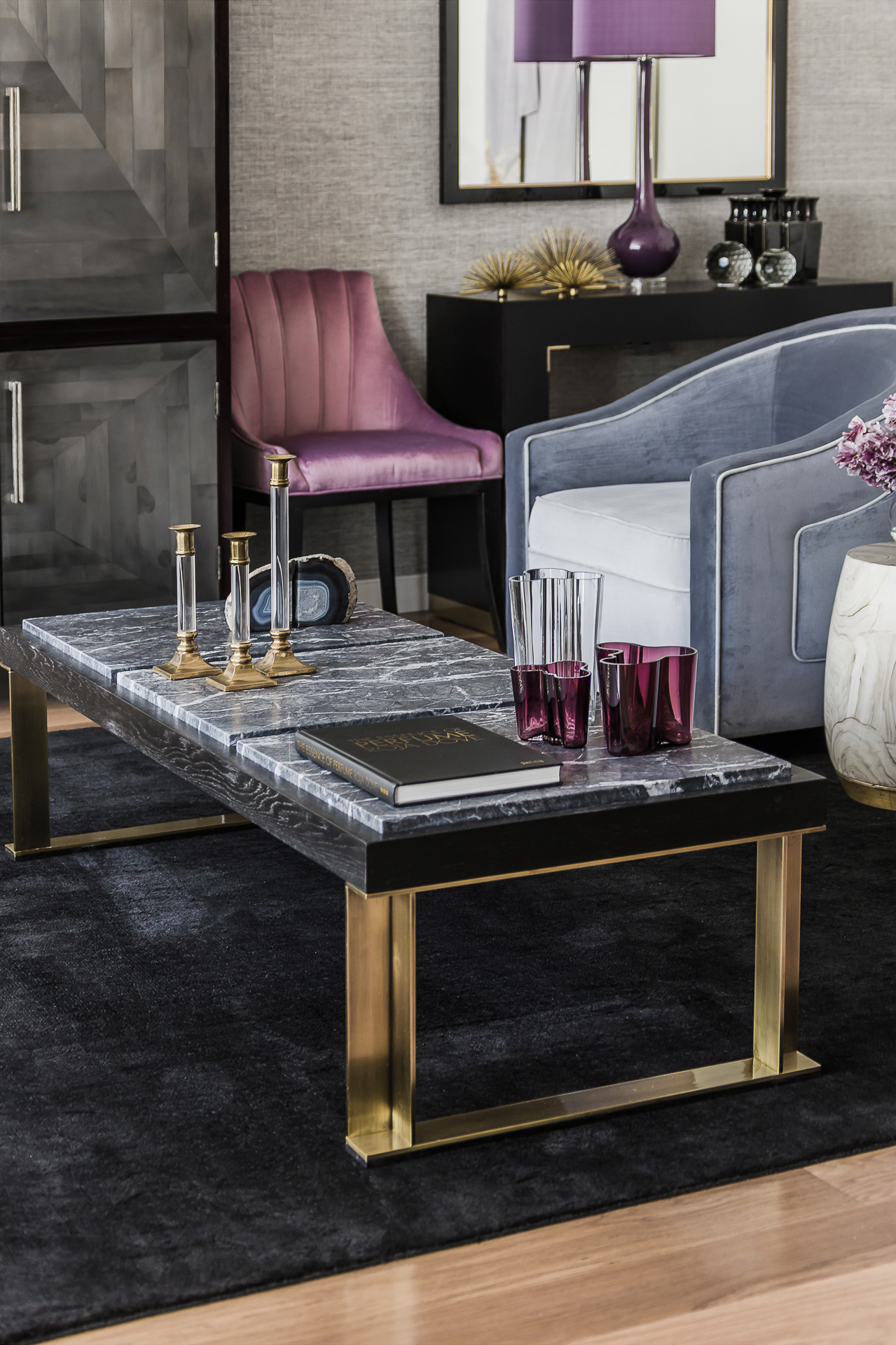 Elegant custom coffee table with brass legs, marble and ebonised timber top by Sydney interior designers, Brendan Wong Design