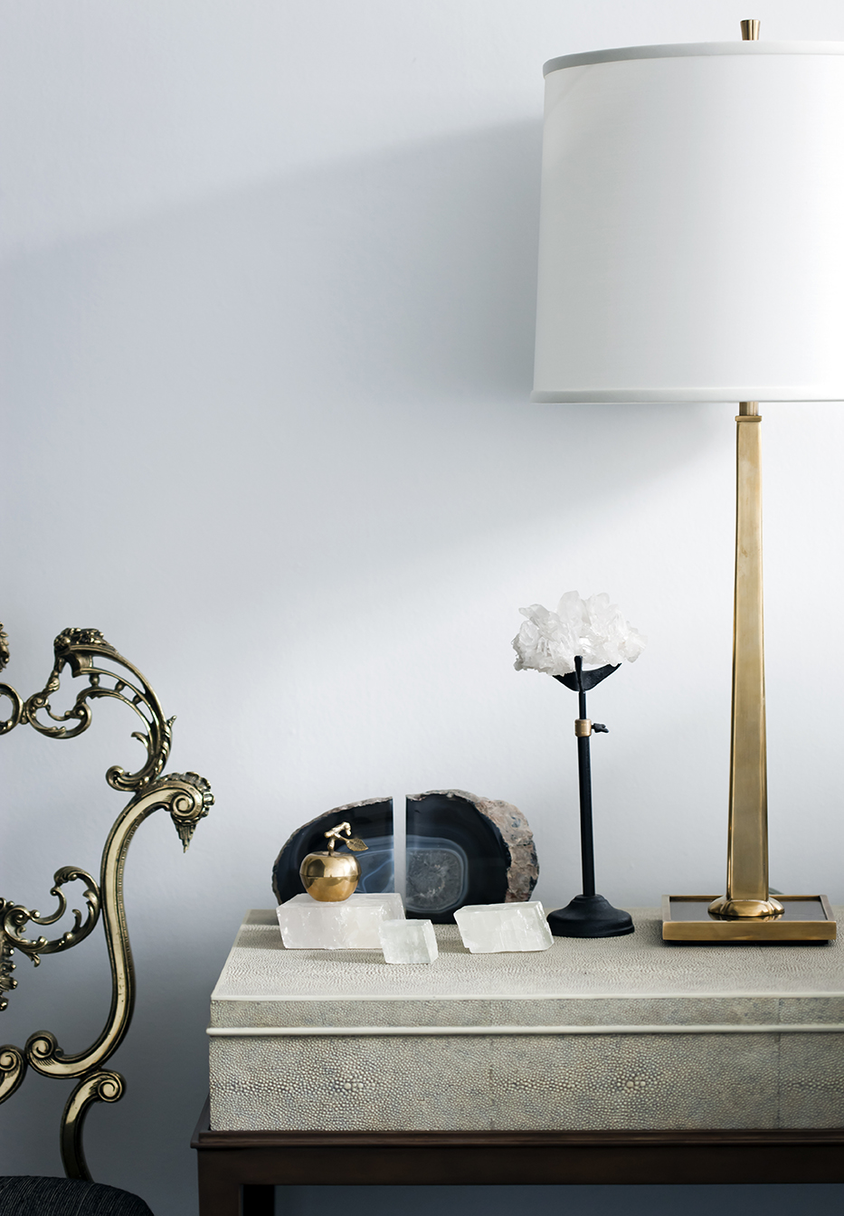 Interior vignette with shagreen console, brass lamp and agate bookends by Sydney interior designers, Brendan Wong Design