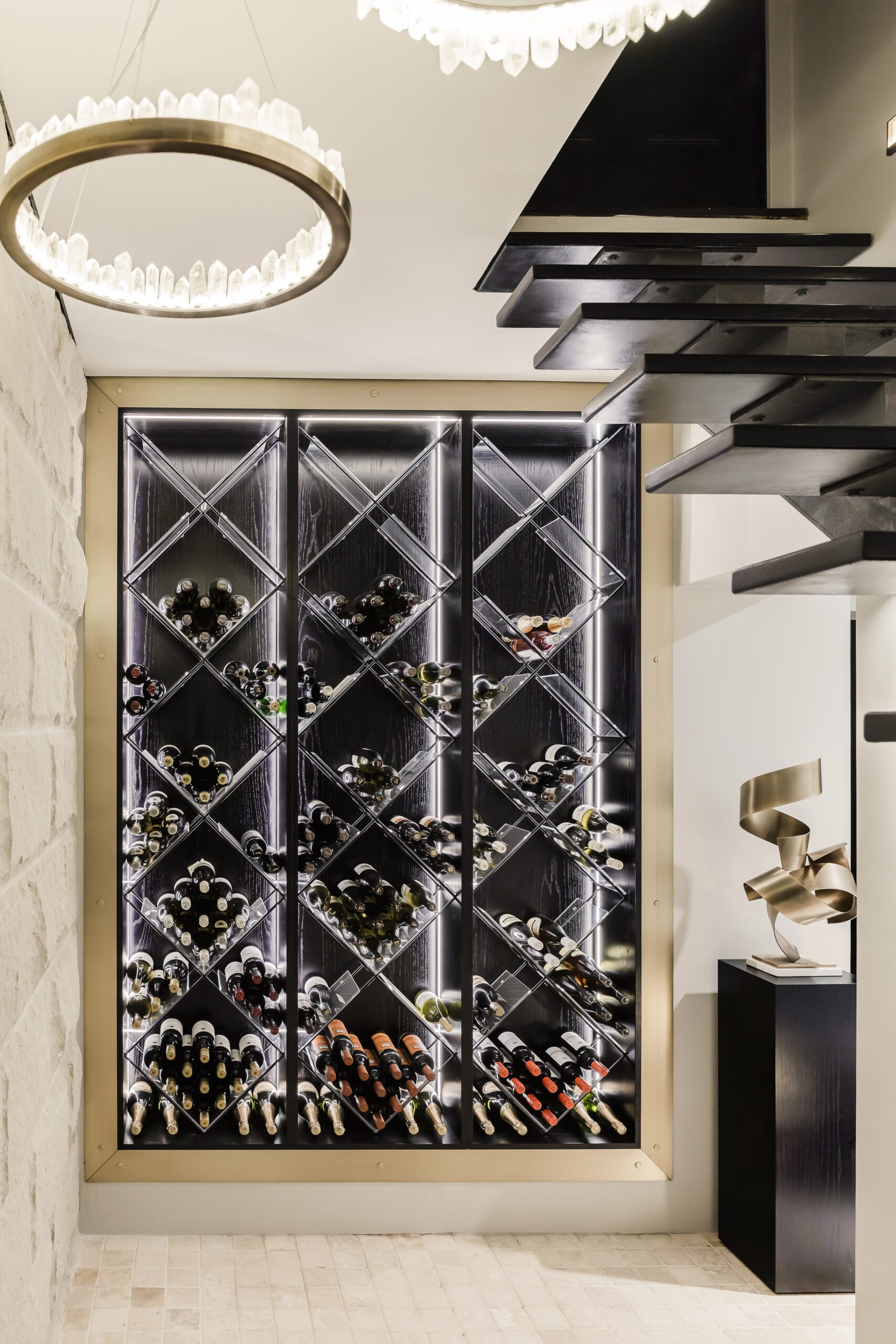 Wine cellar renovation by Sydney Interior Designers Brendan Wong Design, with crystal and brass pendant by Christopher Boots