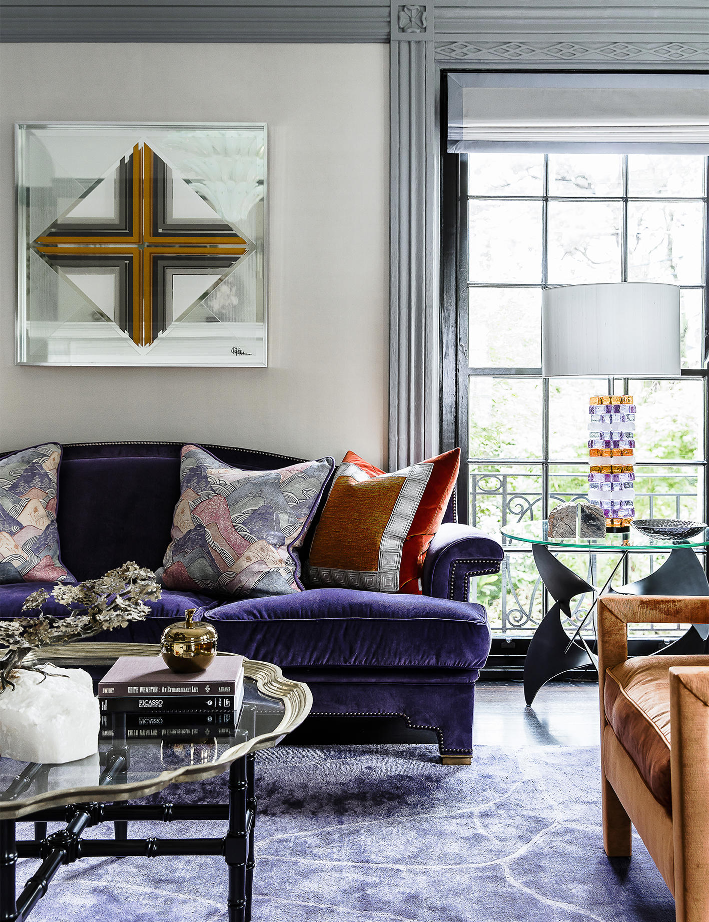 Brendan Wong Design Grand Estate Lounge Room with Purple Loung, Mirror Artwork and orange velvet armchair