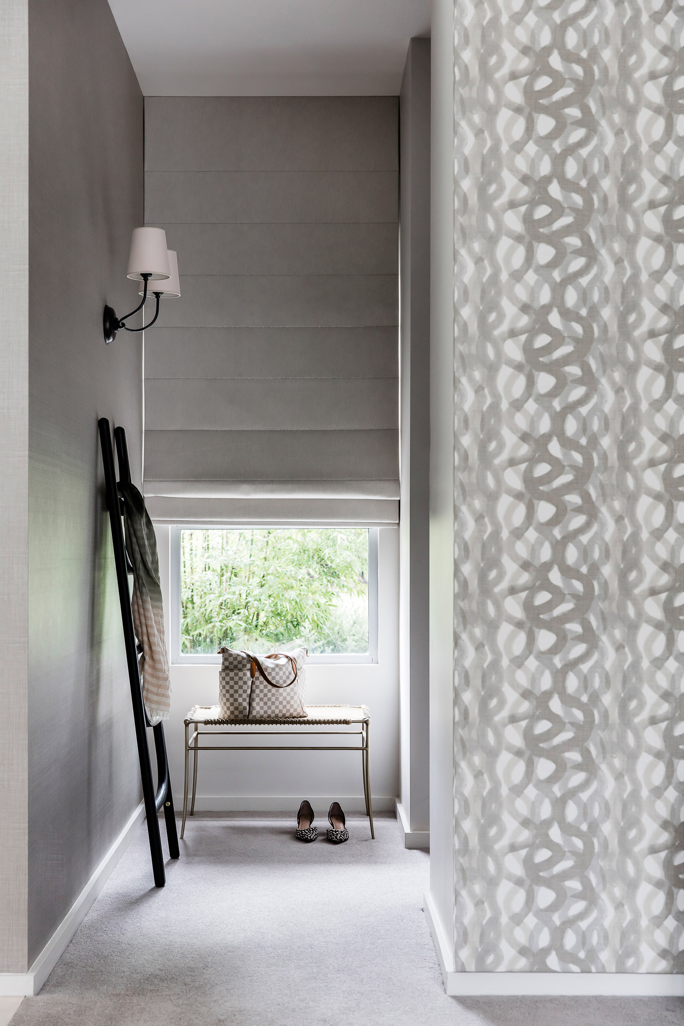 Bedroom window with roman blinds and grey patterned wallpaper by Sydney interior designers, Brendan Wong Design