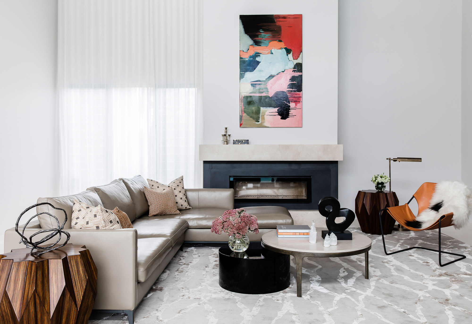 Casual family living room with fireplace, Carolyn O'Neill art and furniture by Sydney interior designers, Brendan Wong Design