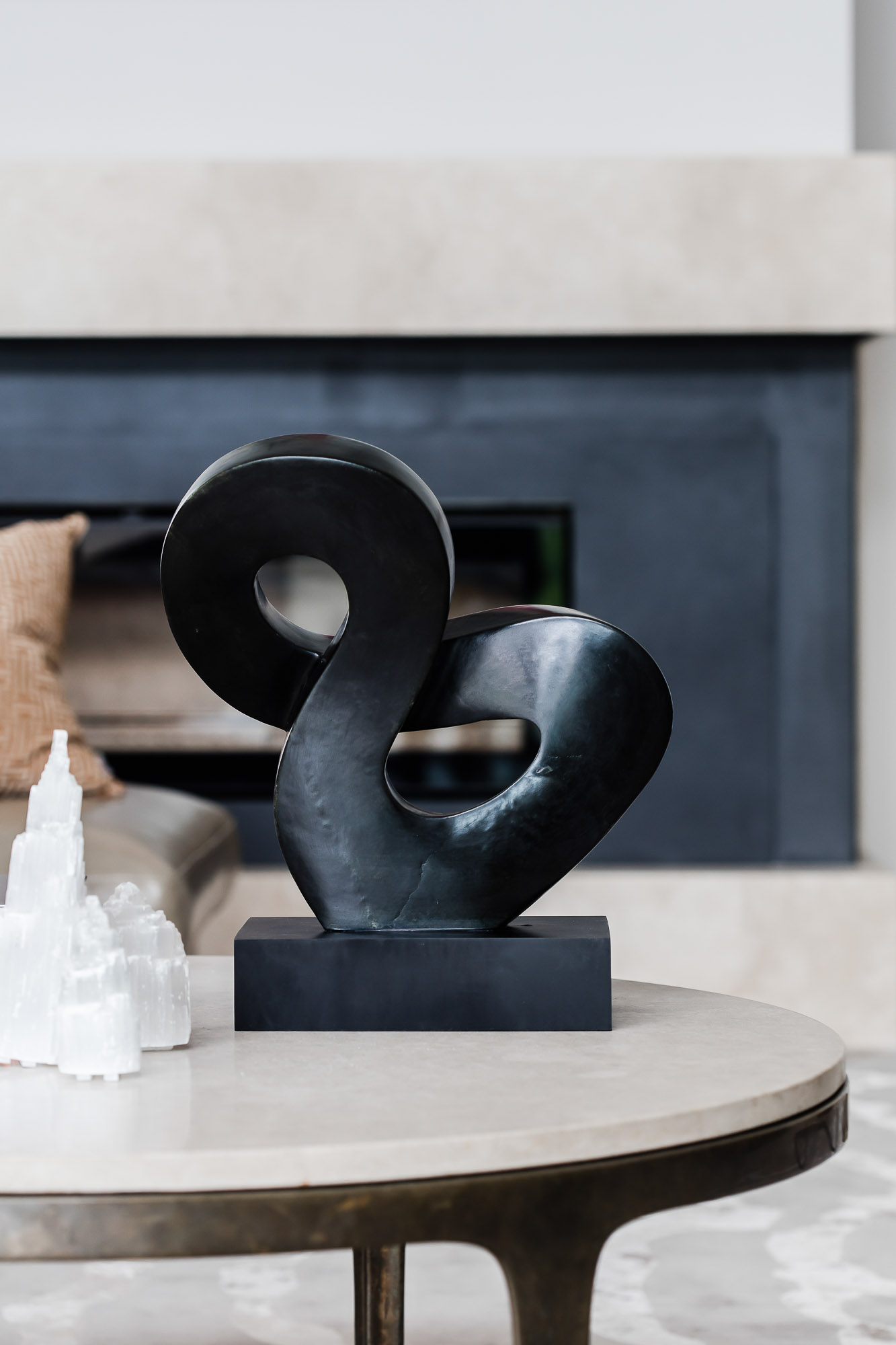 Living room coffee table accessories with sculpture and gypsum gemstone by Sydney interior designers, Brendan Wong Design