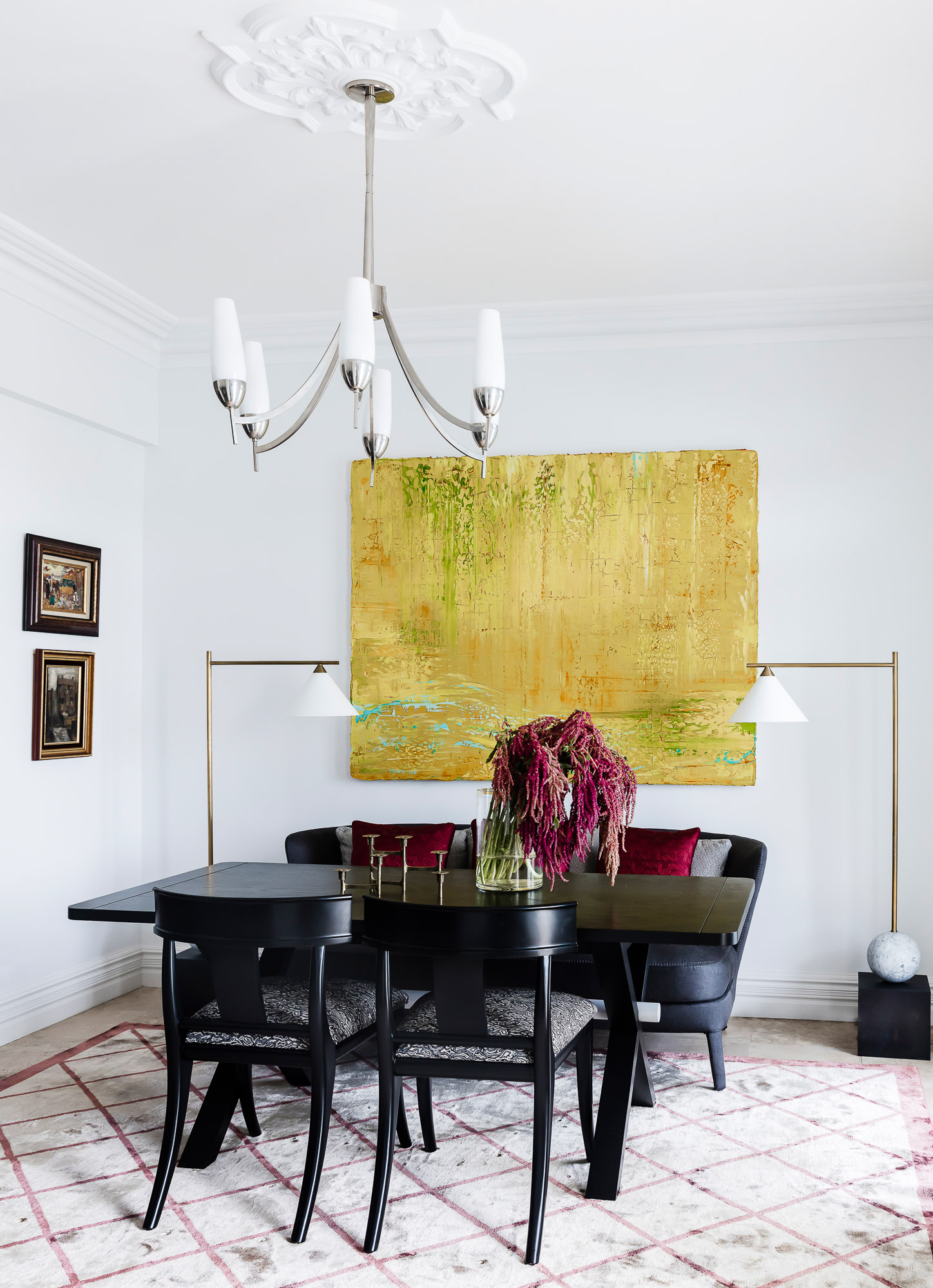 Dining room with Kelly Wearstler floor lamp, yellow artwork and dining sofa by Sydney interior designers, Brendan Wong Design