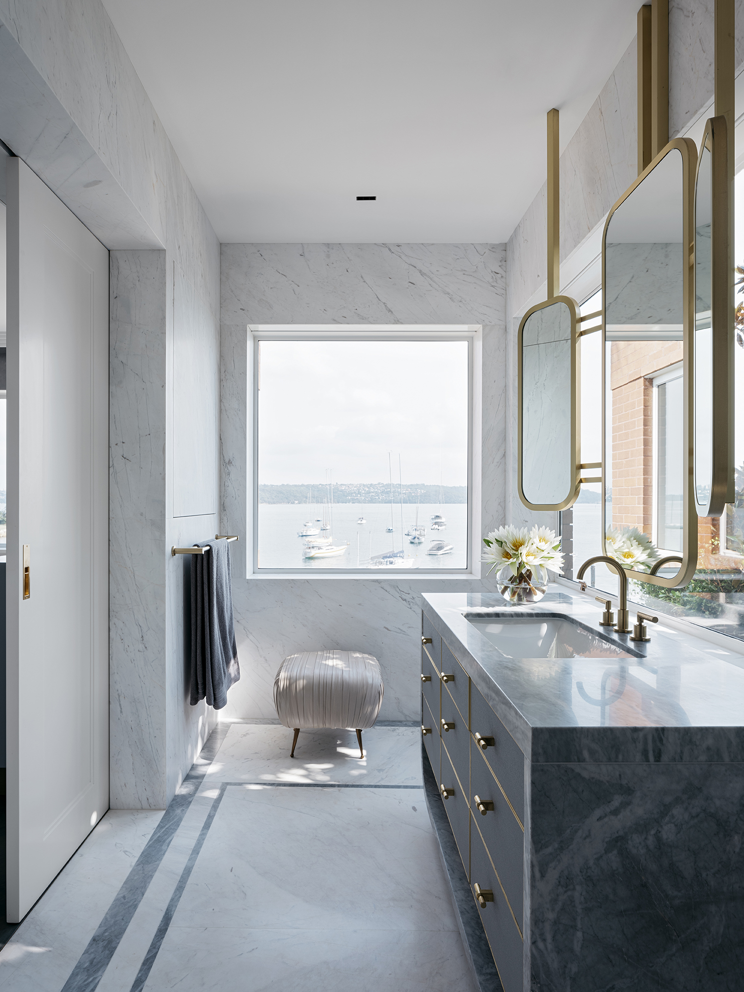 Art deco style bathroom renovation with marble vanity and floating mirrors, by Sydney interior designers, Brendan Wong Design