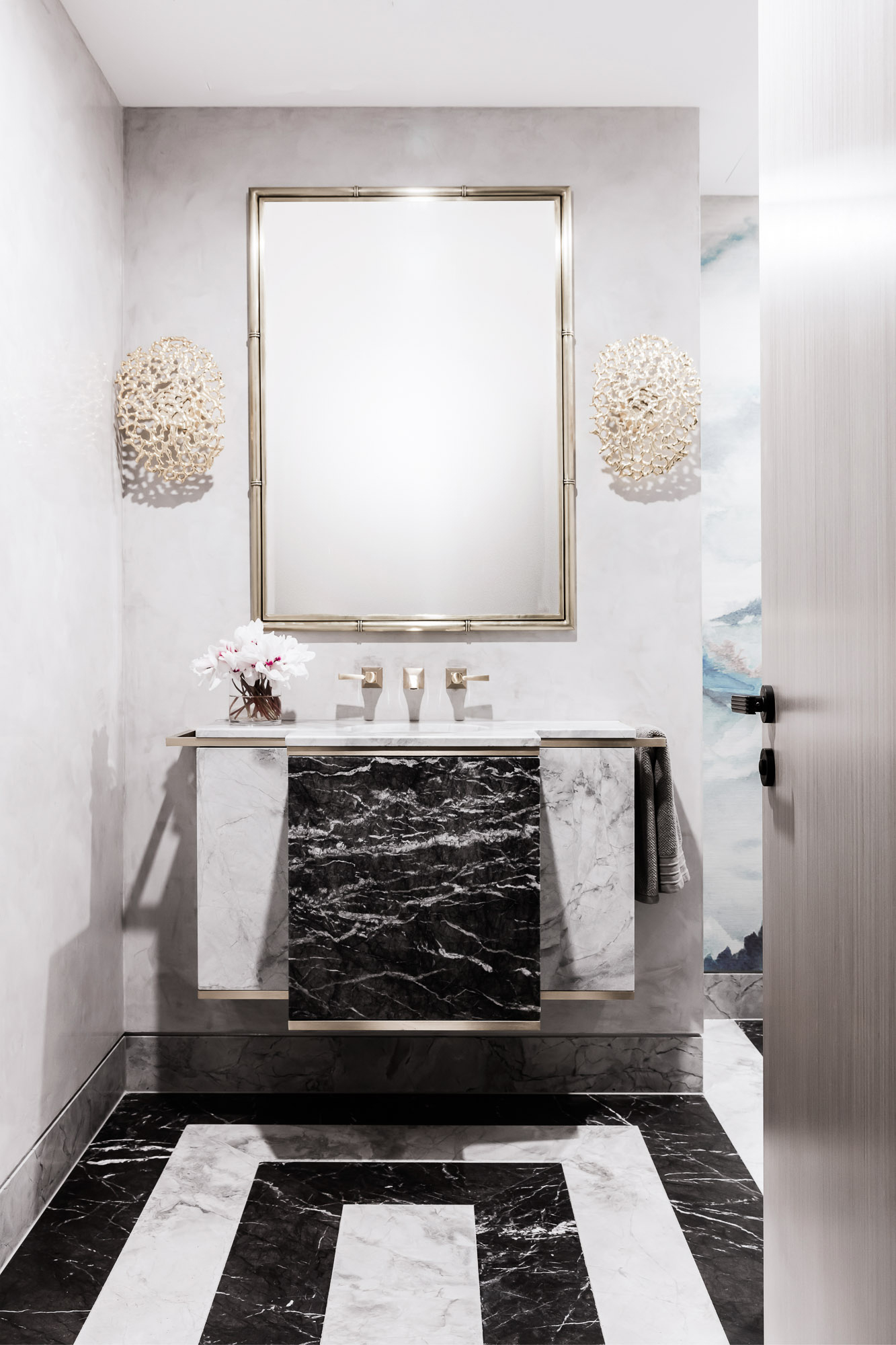 Black and white marble powder room renovation with brass mirror, by Sydney interior designers Brendan Wong Design