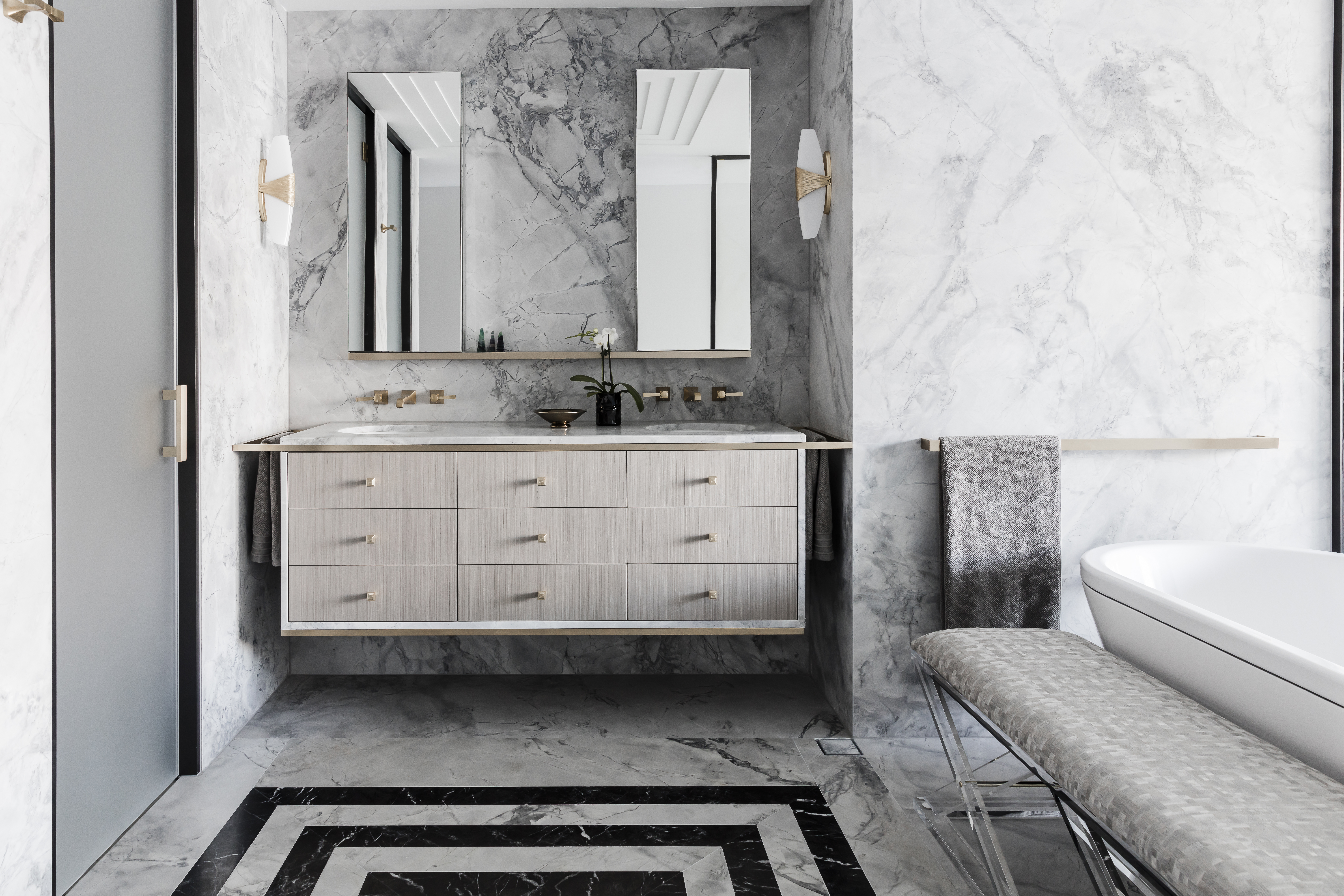 Black and white marble bathroom renovation with freestanding bath by Sydney interior designers, Brendan Wong Design