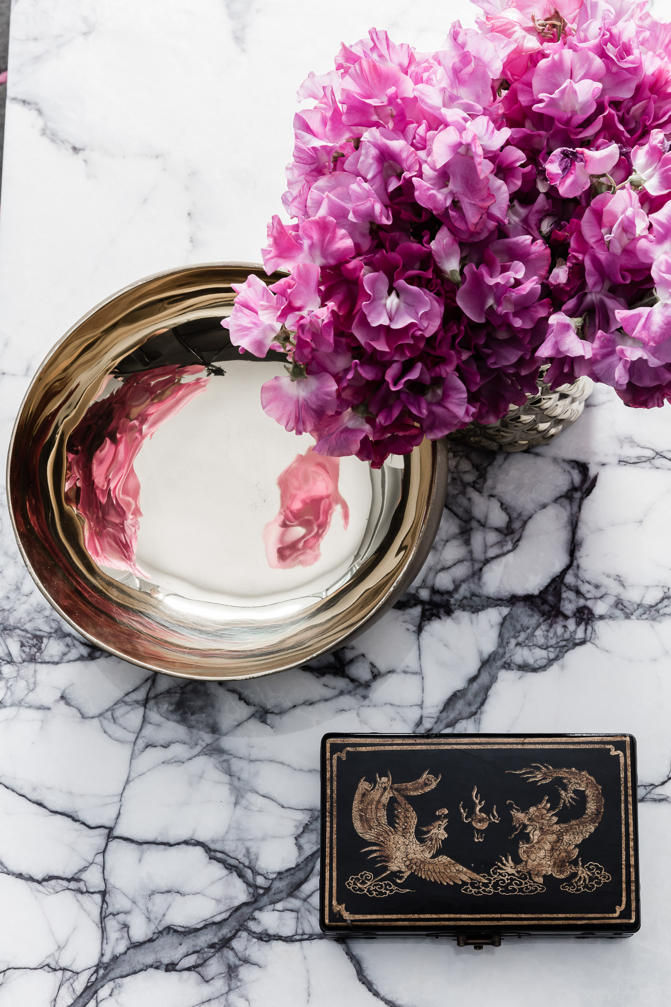 Coffee table decoration flat lay with New York marble and brass bowl, by Sydney interior designers, Brendan Wong Design