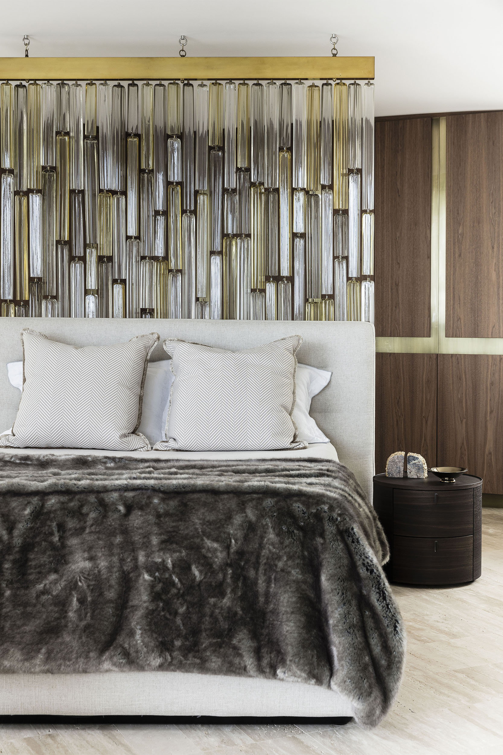 Luxurious Cove House bedroom showcasing a rich mix of velvet textures, bespoke bedhead, and layered cushions, with 1stdibs Venini Murano glass screen, curated by Brendan Wong Design.