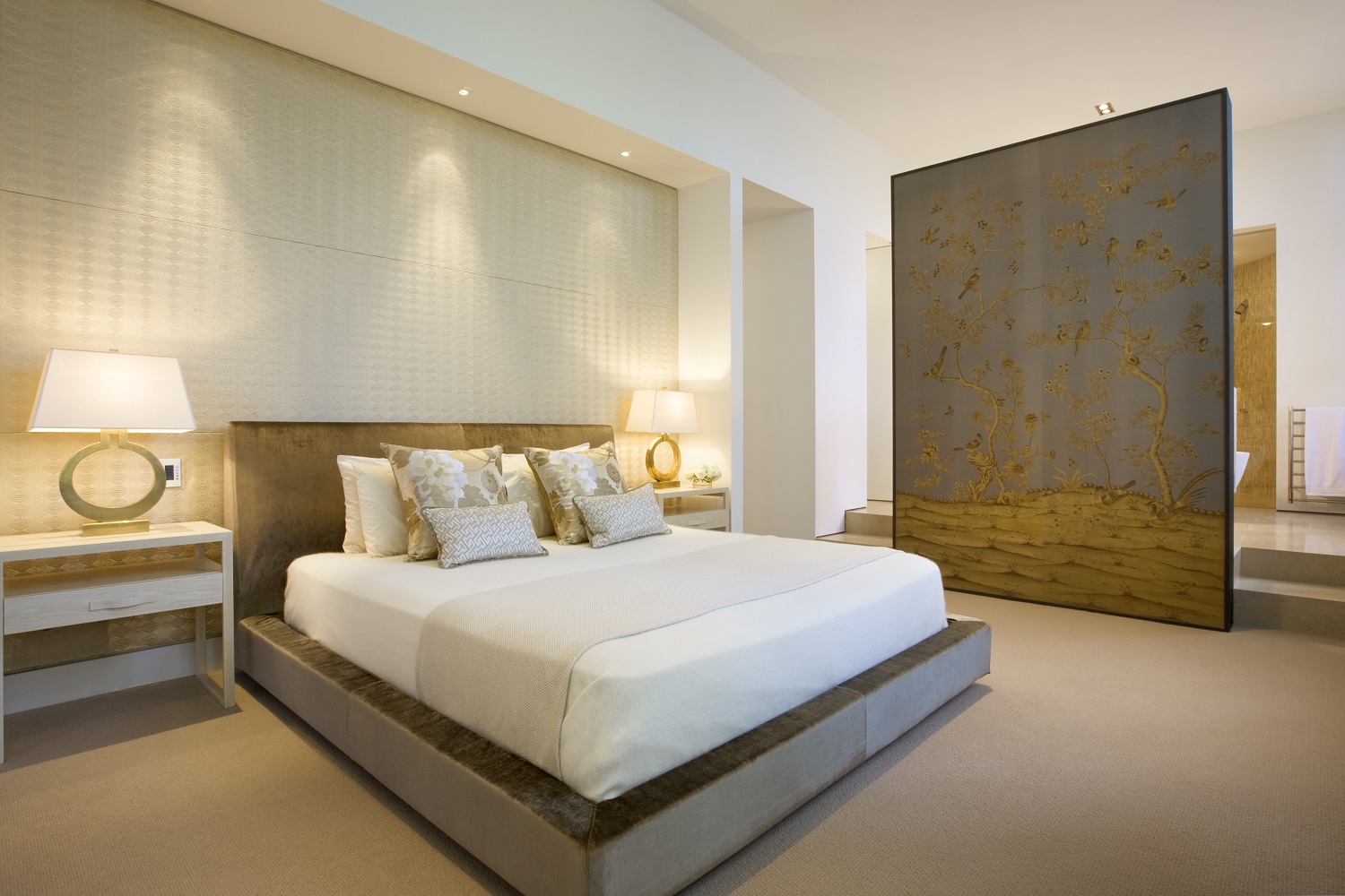 Luxury bedroom design featuring plush upholstered bedhead, neutral palette, and elegant gold decorative screen, designed by Brendan Wong Design in Paddington.